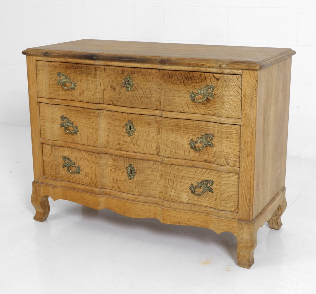 ATTR. VEDEX DANISH OAK CHEST OF DRAWERS C. 1960S: Three drawers with dragon form brass hardware and carved details. Key Included. Apparently unmarked. Denmark, circa 1960's. Dimensions: H 28.5" x W 38.25" x D 17.5" Condition: Heavy discoloration to t