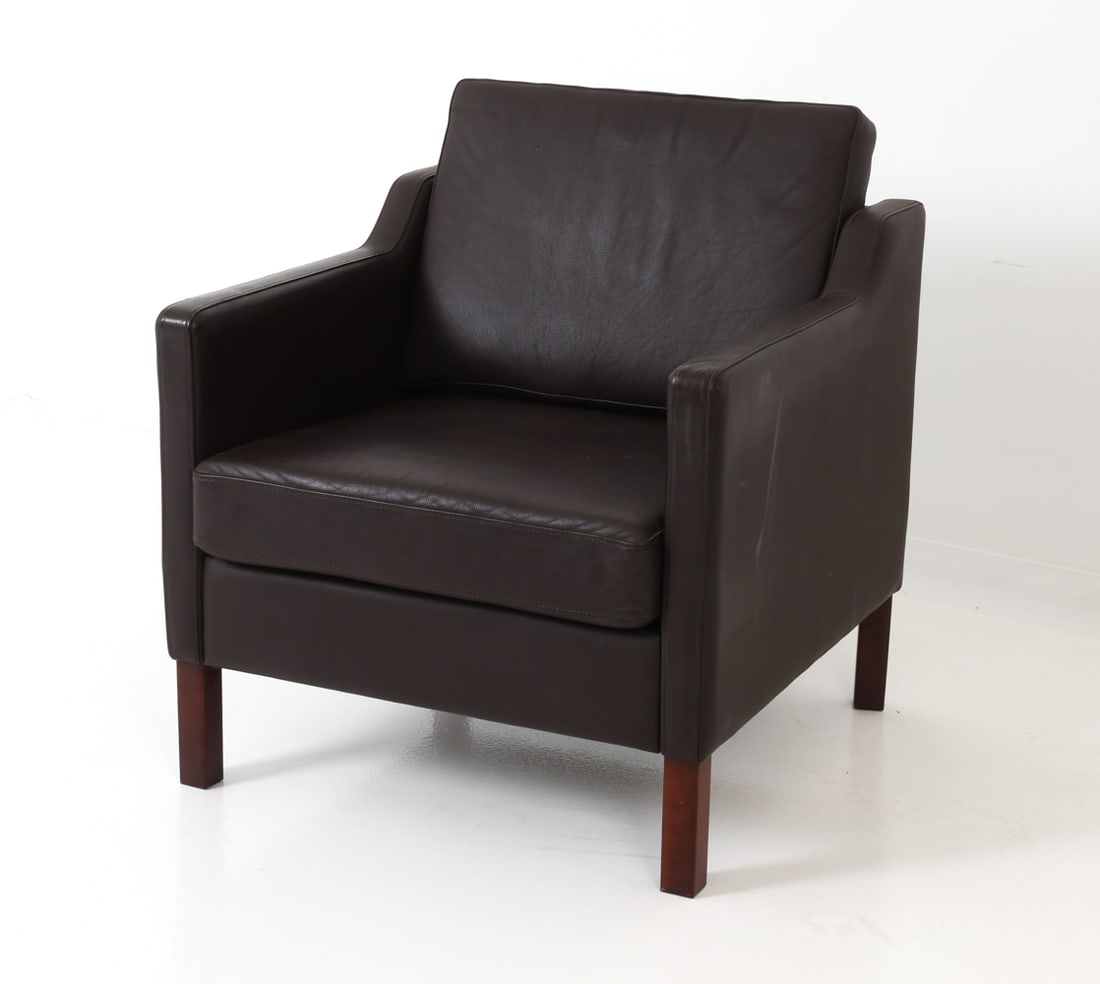 ATTR. STOUBY DANISH LEATHER LOUNGE CHAIR C. 1970S: Beechwood legs and dark brown leather upholstery. Apparently unmarked. Denmark, circa 1970's. Dimensions: H 34" x W 27.5" x D 31" x SH 18" Condition: Wear consistent with age and use. Couple of scuffs