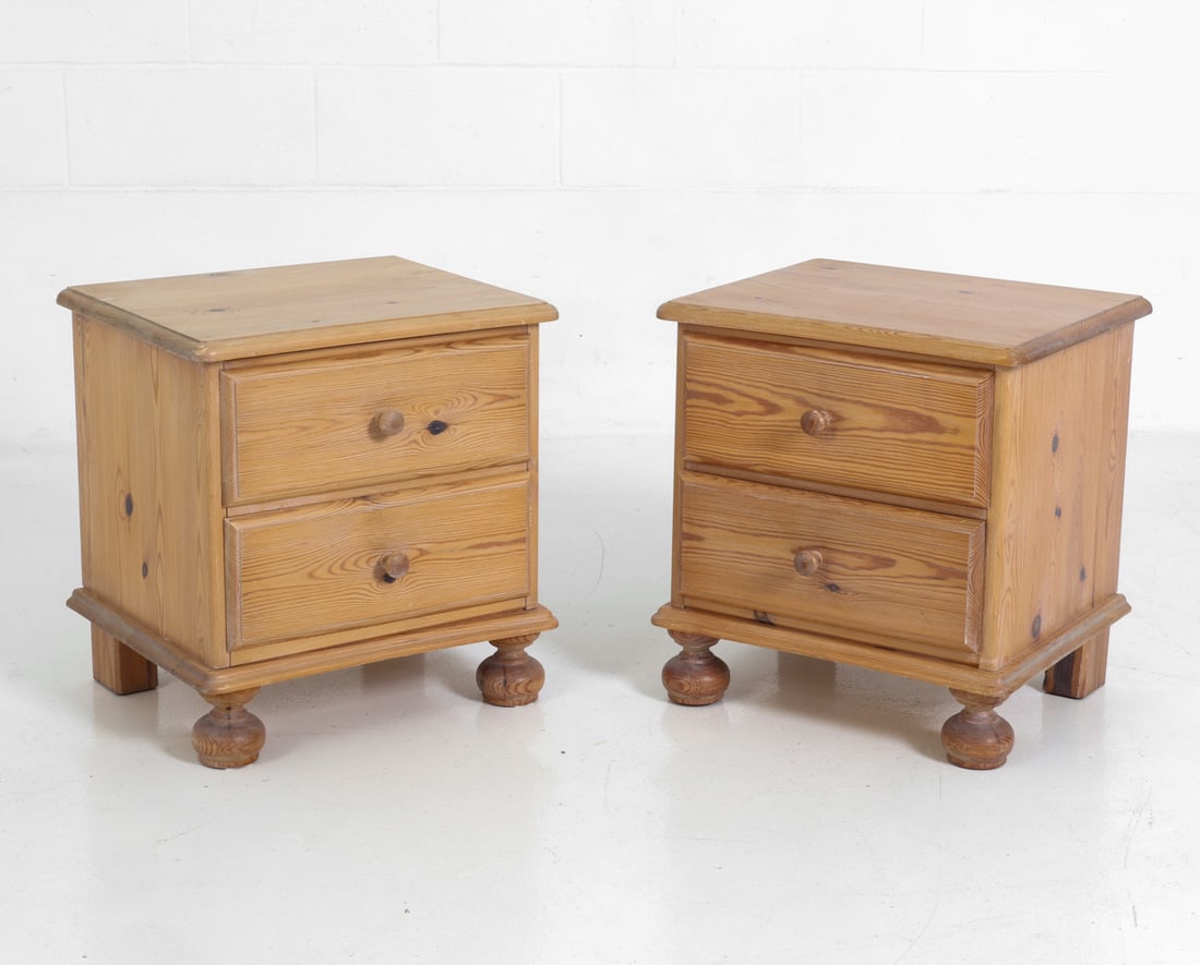PAIR OF SWEDISH PINE NIGHTSTANDS 1960S: Two nightstands with two drawers and round pulls. Sweden, circa 1960's. Dimension: H 19" x W 17.75" x D 15" Condition: Faint stress crack to one side edge, rubs, scuffs to top and sides. Wear consiste