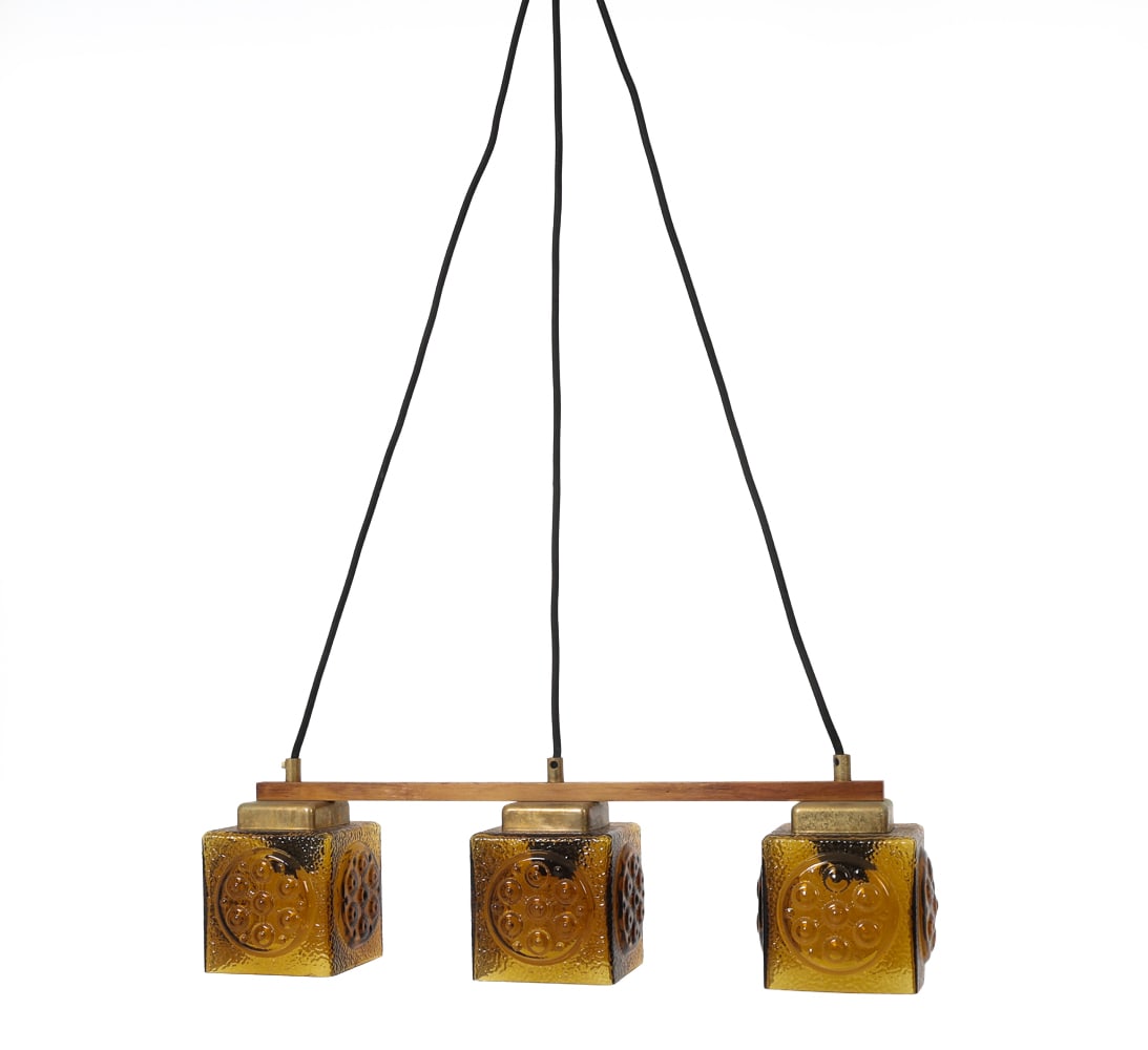 MID-CENTURY SCANDINAVIAN THREE-LIGHT PENDANT LAMP: Featuring a teak beam suspension holding three amber-colored textured glass shades. Scandinavian, circa 1960's. Dimensions: H 6" x W 21.75" x D 4.5" Condition: Not Tested, Wear consistent with age and