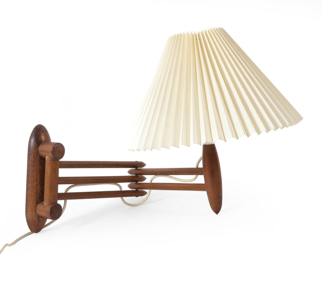 SCANDINAVIAN TEAK EXTENDING ARM WALL SCONCE: Comes pleated shade. Scandinavian, circa 1960's. Dimensions: (Extended) H 8.75" x W 13.5" x D 20.25" Condition: Not Tested, European Plug, Wear consistent with age and use.