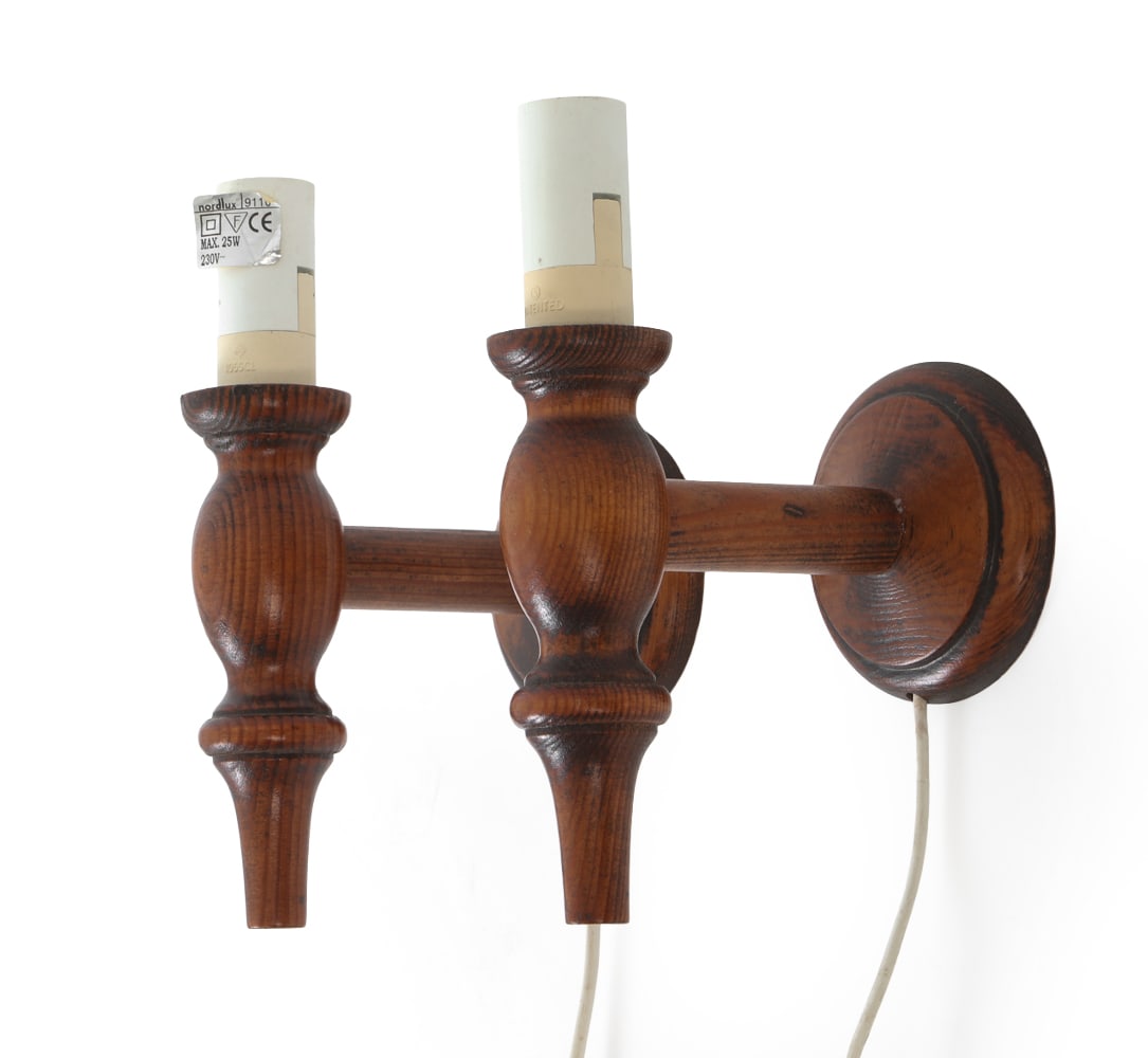 PAIR OFF SCANDINAVIAN PINE WALL SCONCES 1960S: Stained pine wall sconces. Scandinavian, circa 1960's. Dimensions: H 7.75" x W 3.5" x D 5.5" Condition: Not Tested, European Plug. Wear consistent with age and use. Scuffs and rubs.