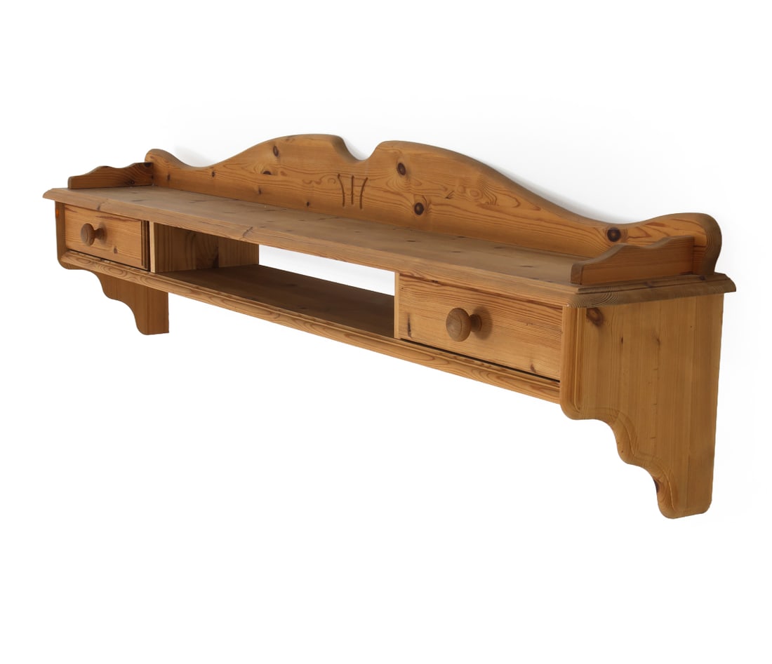 MID-CENTURY SWEDISH PINE FLOATING WALL SHELF: With two drawers, hand carved edges, in the classical Scandinavian country style design. Sweden. Dimensions: H 15" x W 61" x D 9" Condition: Wear consistent with age and use. Nicks, dings to edges.