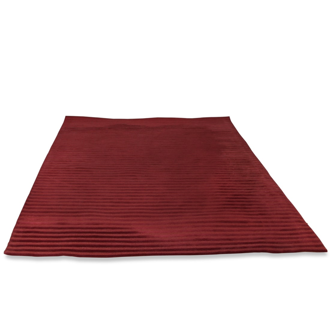 MAURICE VILLENCY STRIPED RUG: A plush hand-loomed rug, with a carved linear design and beautiful red tones adding texture, dimension, and sophisticated style. Dimensions: L 108" x W 73" Condition: Wear consistent with age and use.