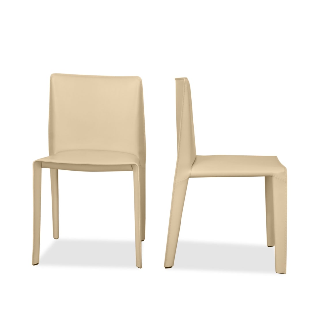 PAIR OF B&B ITALIA 'DOYL' SIDE CHAIRS: Pair of B&B Italia Doyl Dining Chairs by renowned designers Gabriele and Oscar Buratti combines minimalist elegance with meticulous craftsmanship. Upholstered in luxurious leather, these chairs featur