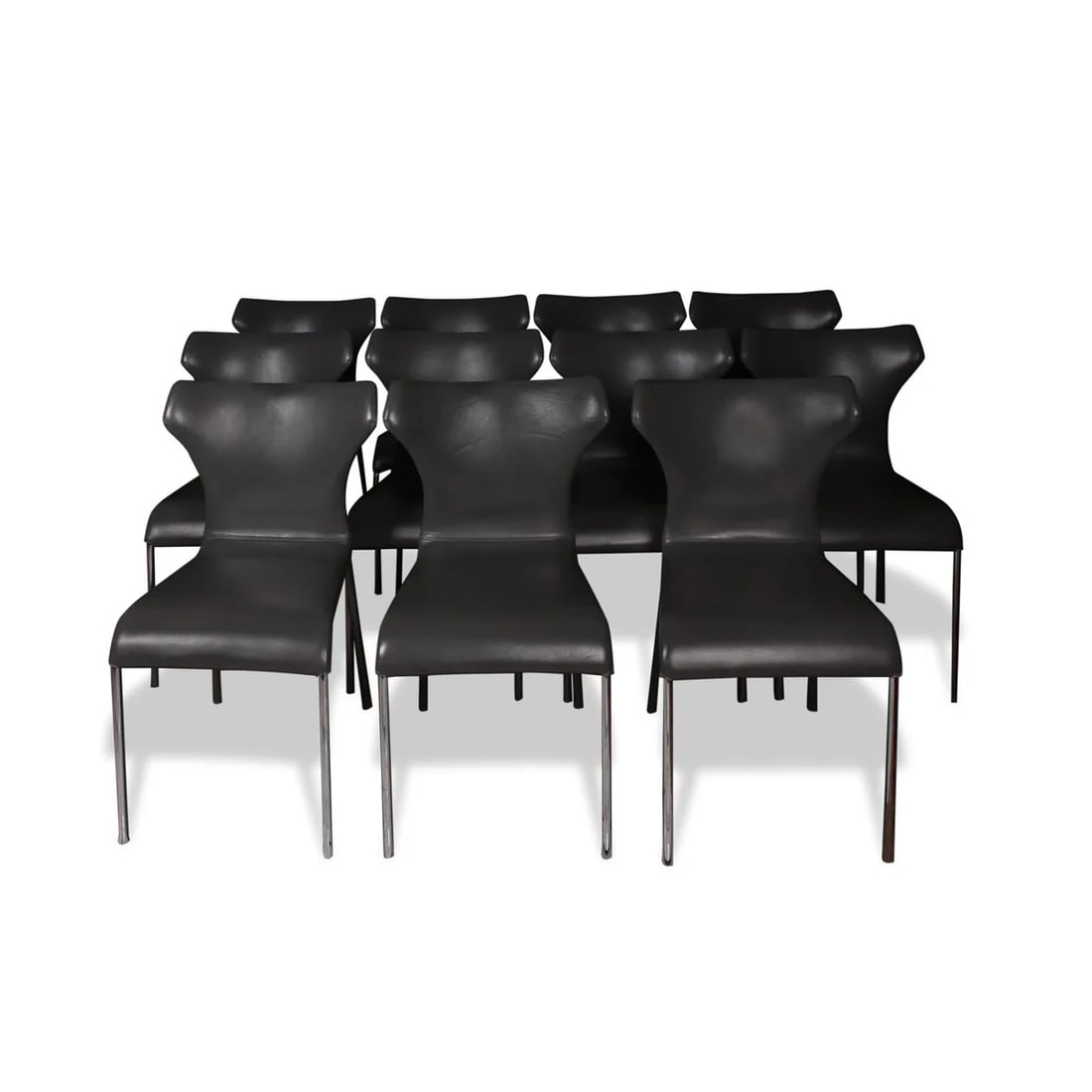 (11) B&B ITALIA 'PAPILIO' CHAIRS: Curvy chairs with a zipper detail on their back, comfortable and chic, Papilio means butterfly in Latin, and the piece has this name because of the wings in its backrest extending on the sides