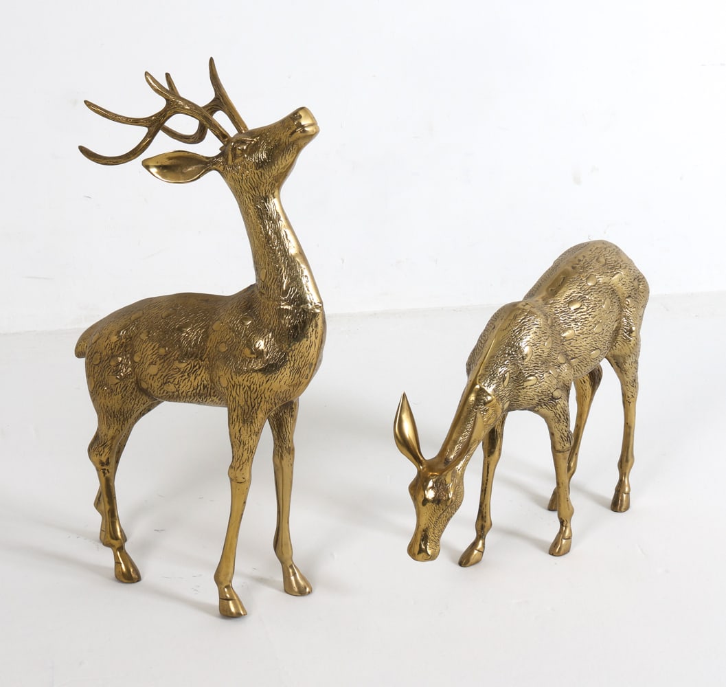 PAIR OF BRASS DEER SCULPTURES: (2) Brass deer figurines. Contemporary. Dimensions: Largest H 23" x 17" x 13" x 5". Condition: Few minor scuffs and rubs. Remnant of tag to underside of one.