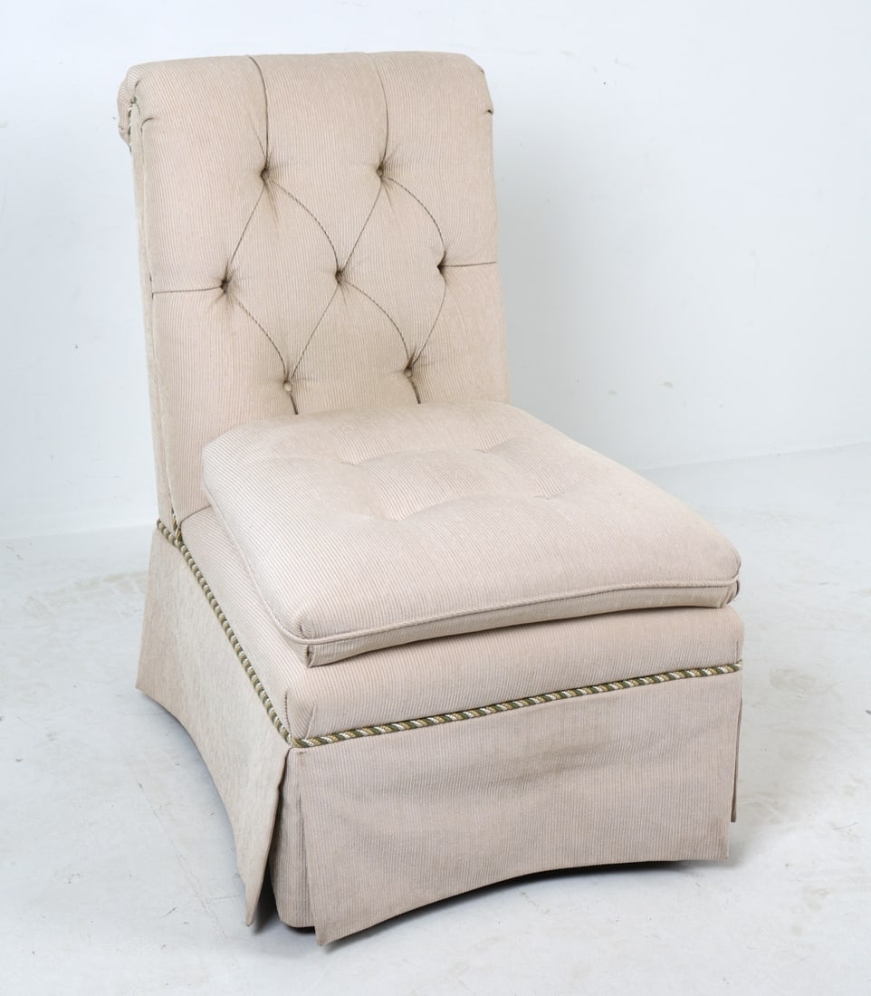 PARSONS STYLE TUFTED SLIPPER CHAIR: Tufted slipper chair in beige corduroy upholstery. Button-tufted backrest with cord details. Circa 1980s. Dimensions: H 37" x W 20.5" x D 27.25" x SH 18.5". Condition: Few scuffs to legs.