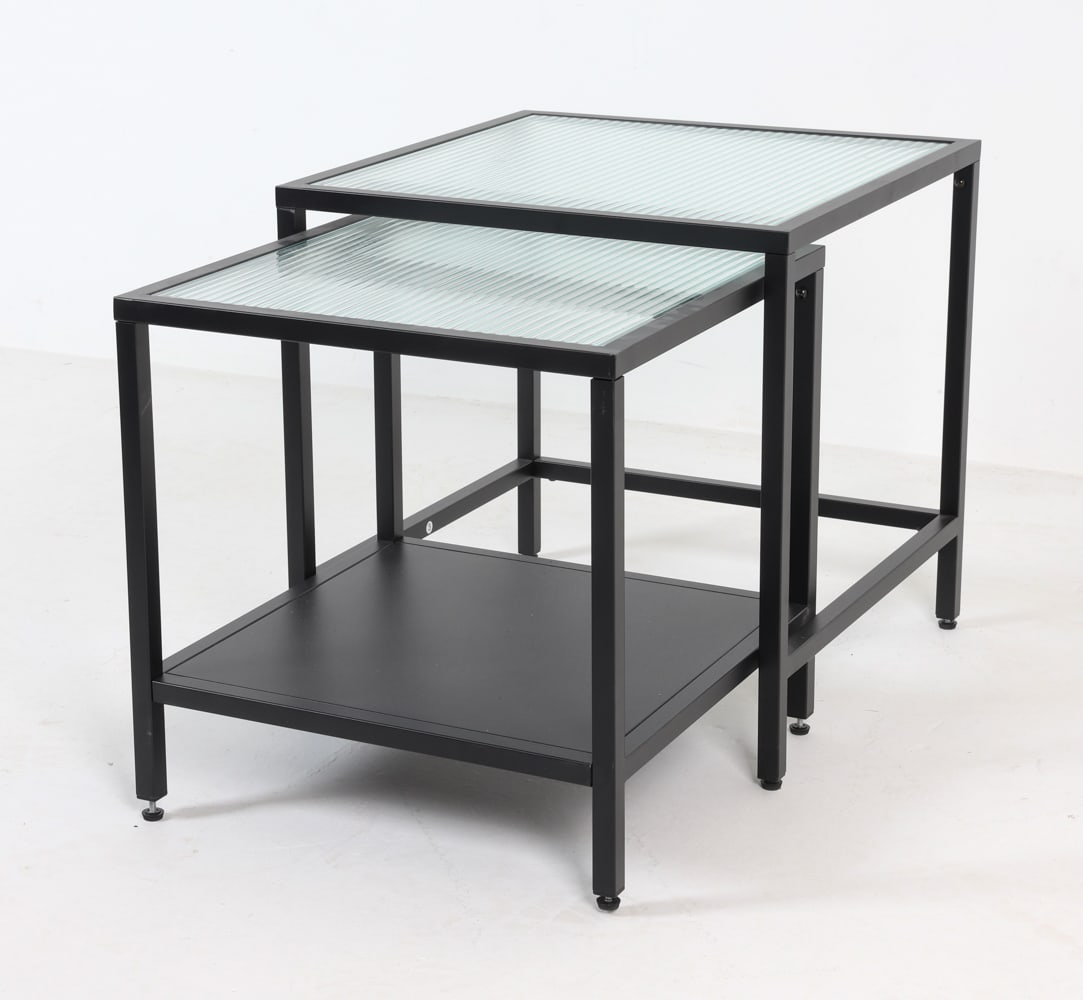 CONTEMPORARY PAIR OF STEEL & GLASS NESTING TABLES: Dimensions: (larger) H 19.75" x W 19.75" x D 19.75" Condition: No issues to note.