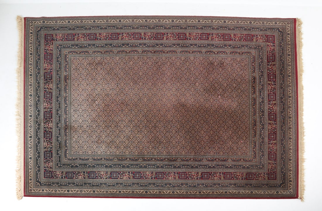 HAND-KNOTTED WOOL ORIENTAL RUG: Labeled indistinctly underneath. Dimensions: L 134" x W 94". Condition: Showing light signs of wear consistent with age and use.