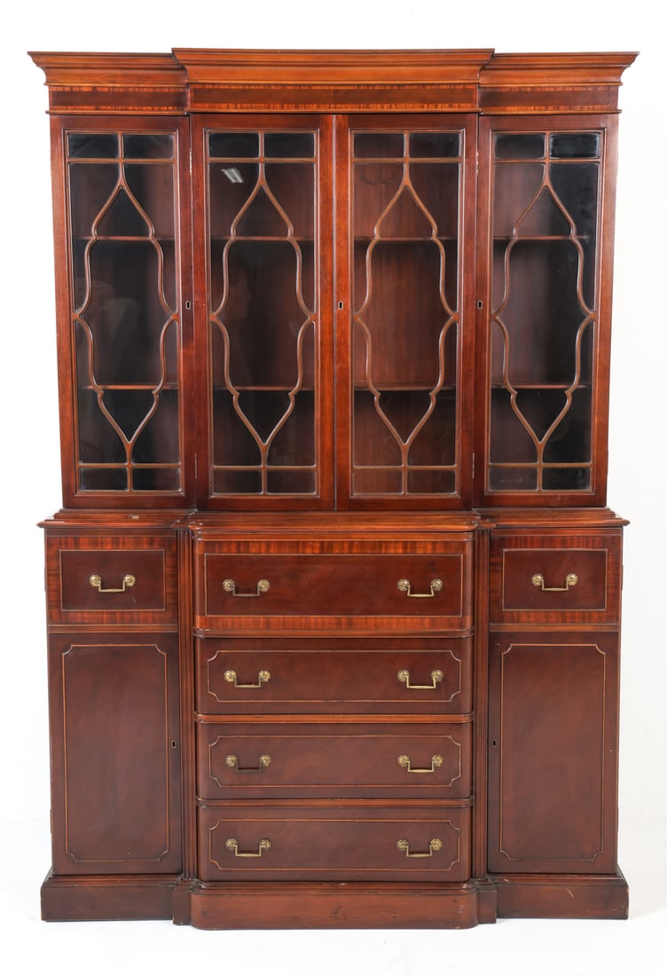 MADDOX MAHOGANY DISPLAY CABINET C. 1950S: Georgian style mahogany display cabinet by Maddox Tables. Glass panels and astragal patterns to top. Secretary cabinet with pull-out desk to center. Tagged to back. Mid 20th century. Dimensions: H