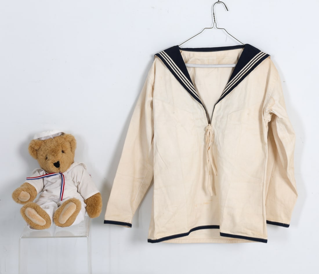 VINTAGE US NAVY JACKET: Vintage Navy uniform jacket together with teddy bear dressed in a Navy uniform. Dimensions: Jacket H 27" x W 17.5". Sleeve L 22". Condition: Slight sun fading. Wear consistent with age and use.