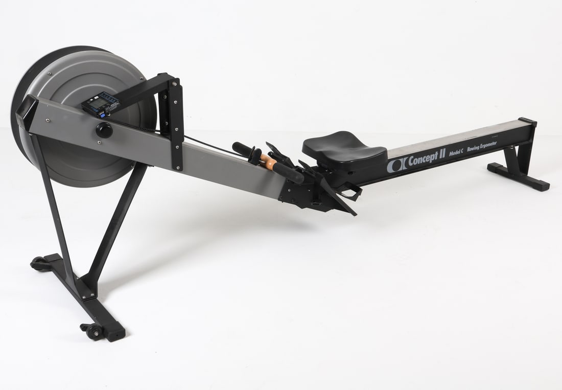 CONCEPT2 ROWER INDOOR ROWING MACHINE: Model C. Marked to central bar. Dimensions: H 34" x W 14" x D 95". Condition: Wear consistent with age and use, battery cover has small crack.