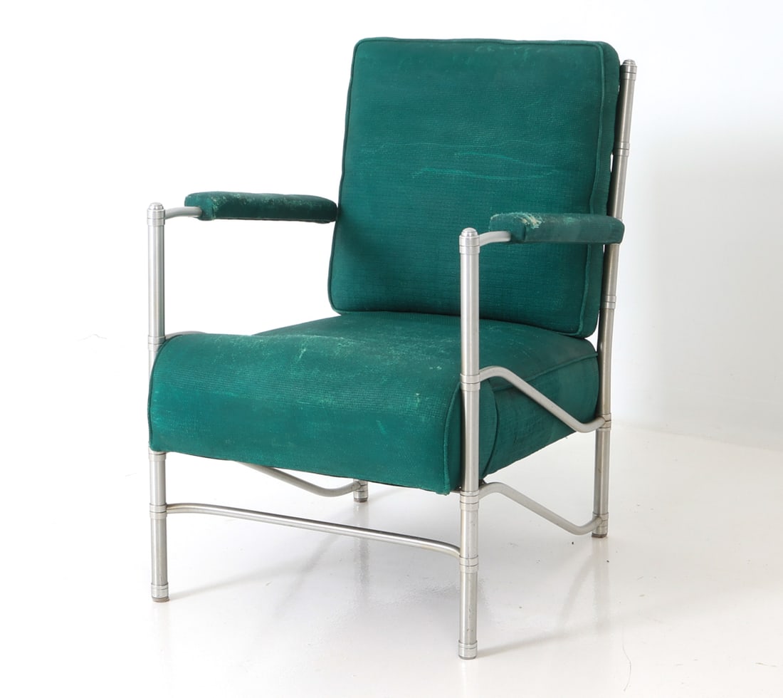WARREN MCARTHUR DECO ALUMINUM LOUNGE CHAIR: Great reupholstery project. Dimensions: H 33" x W 23.75" x D 31" x Sh 17" Condition: Tear to seat and armrest, fraying to seat and armrest, Wear consistent with age and use. Original upholstery.