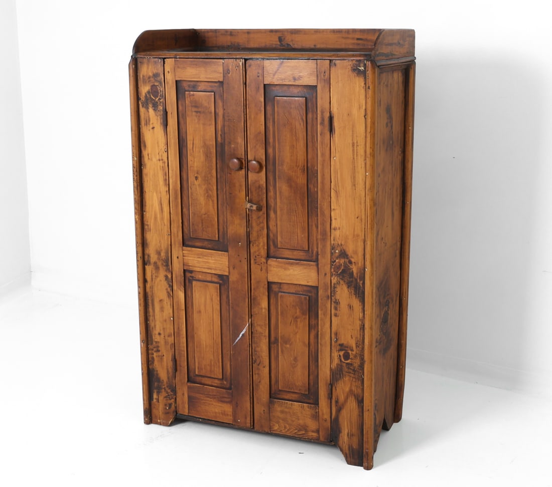 19TH C. ANTIQUE COUNTRY PINE CABINET: Featuring two hand carved blind paneled doors and three shelves inside the unit, with original pulls. Circa 19th Century. Dimensions: H 62" x W 38" x D 16.5" Condition: Wear consistent with age and us