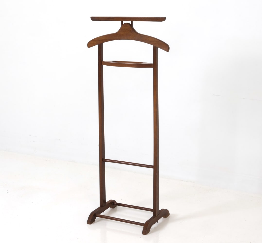 MID-CENTURY GENTLEMEN'S VALET CIRCA 1960'S: Solid beechwood valet. Circa 1960's. Dimensions: H x 41.25" W 18.25" x D 11.25" Condition: Minor scuffs and wear consistent with age.