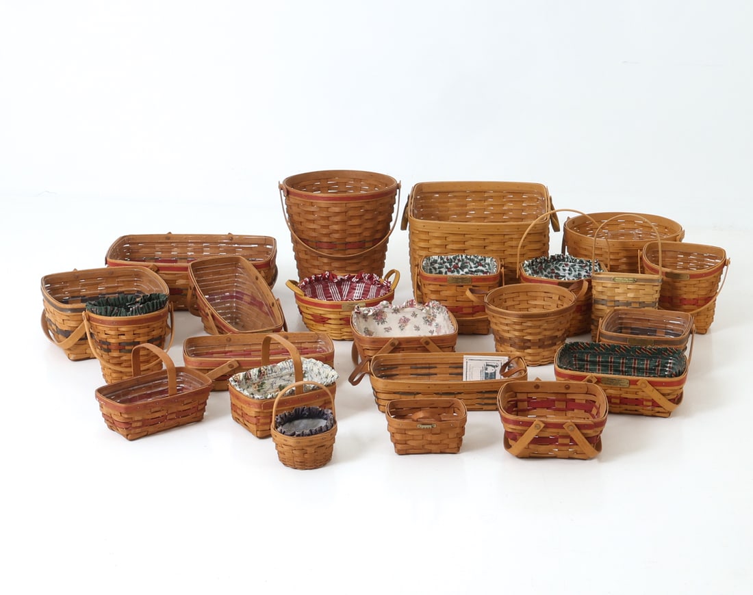 LONGABERGER BASKET GROUPING C. 1990S: Grouping of Longaberger baskets in a variety of shapes and sizes, marked and dated on sides. Dimensions: (Largest) H 12.25" x W 16.5" x D 10.5" Condition: Wear consistent with age and use including