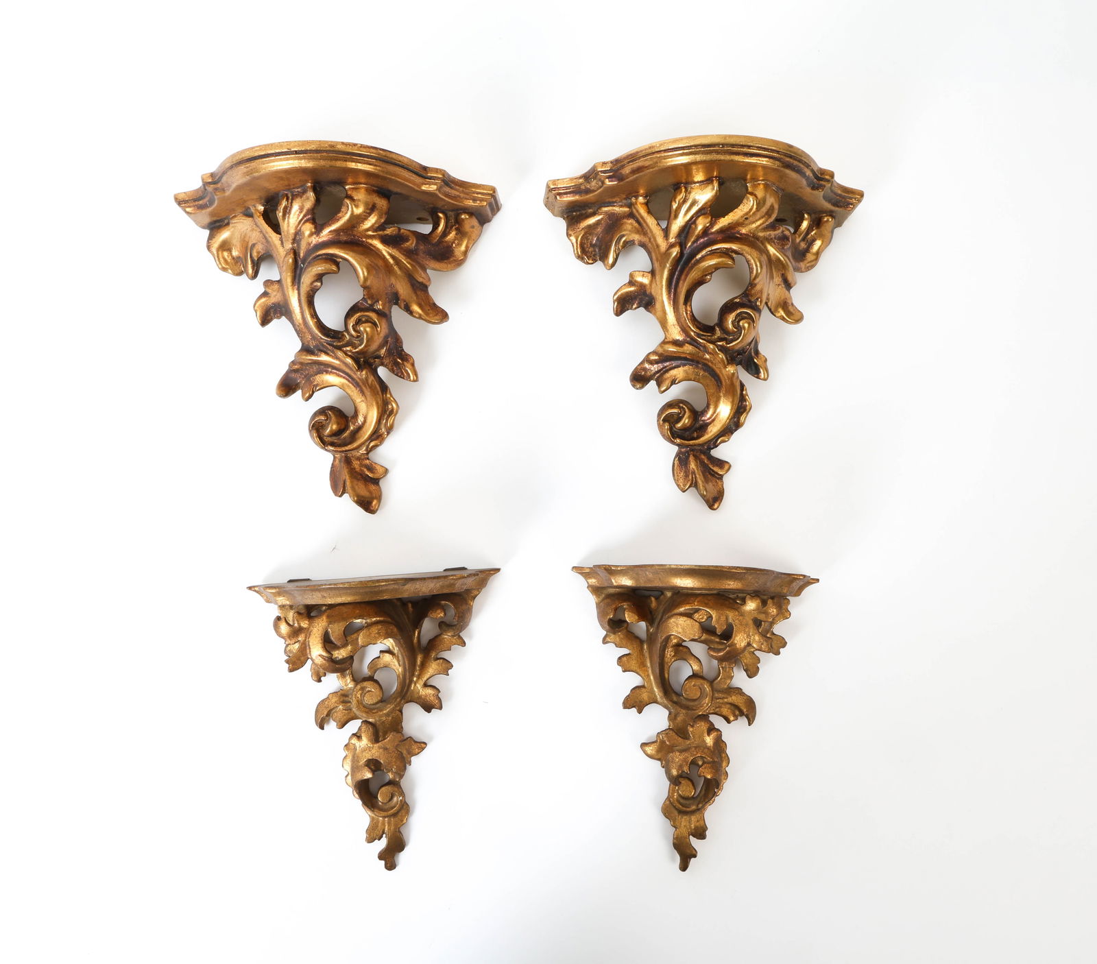 VINTAGE ITALIAN GILT WALL BRACKETS: Mid-20th century Italian gilt wood wall brackets. Dimensions: H 9" x W 8.25" x D 4,5" Conditions: Wear consistent with age and use including minor rubs and scuffs.