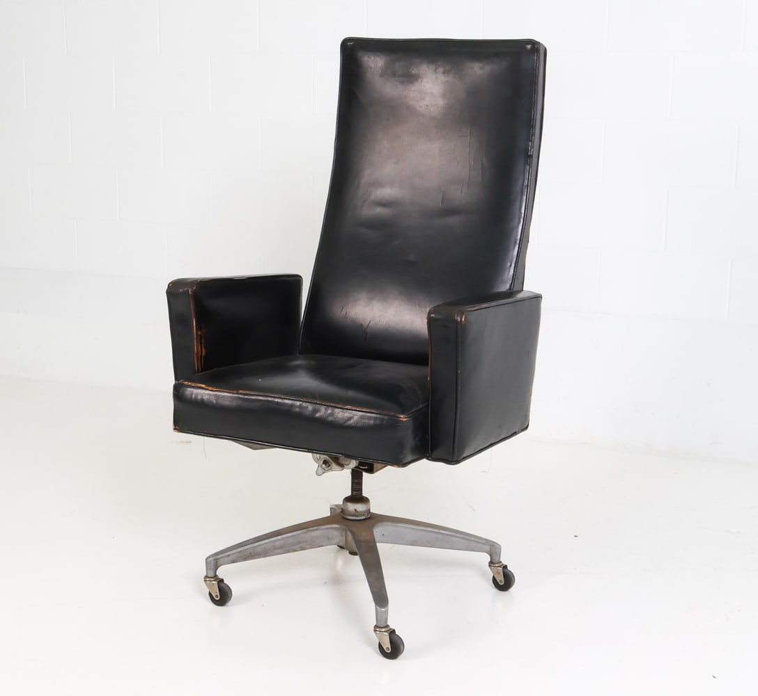 MILO BAUGHMAN STYLE LEATHER DESK CHAIR C. 1970S: Office armchair in leather upholstery and brushed steel frame on casters. Circa 1970s. Dimensions: H 47.75" x W 26" x D 27" x Sh 20.75" Condition: Rubs and scuffs to leather and legs, Wear consistent