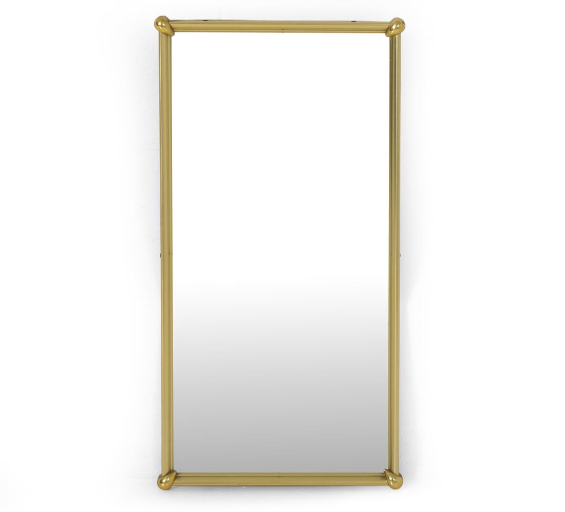 SCANDINAVIAN BRASS WALL MIRROR 1970S: Gold-toned frame mirror. Scandinavian, circa 1970's. Dimensions: H 24" x W 12.5" x D 1" Condition: Wear consistent with age and use as displayed. PR067