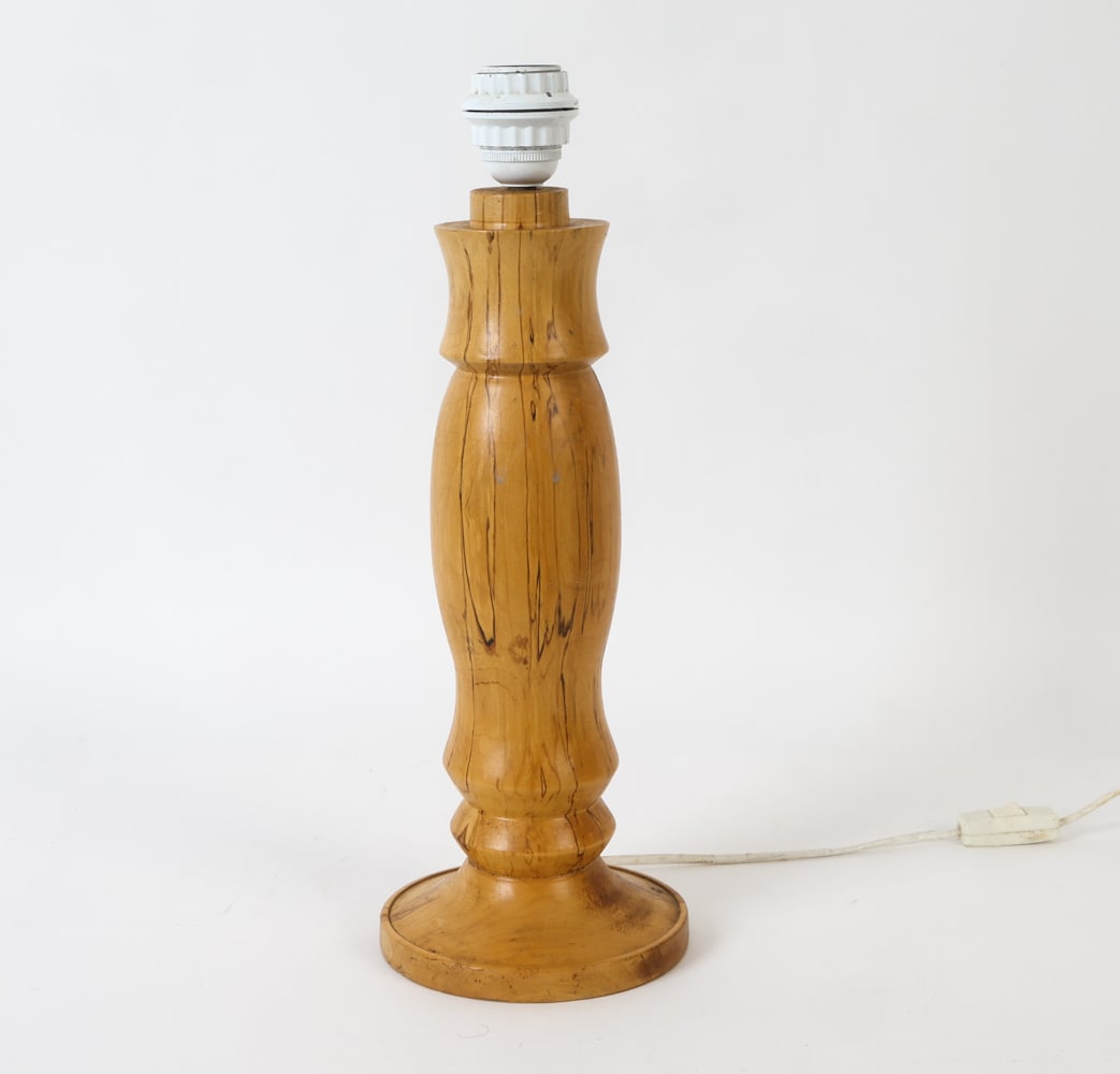 BRUTALIST SWEDISH BEECH TABLE LAMP 1970'S: Turned pine lamp with beautiful finish. Sweden, circa 1970's. Dimensions: H 18" x Diameter 6.5" Condition: Untested, European plug. Some scuffs and dings. Wear consistent with age and use. No shade.