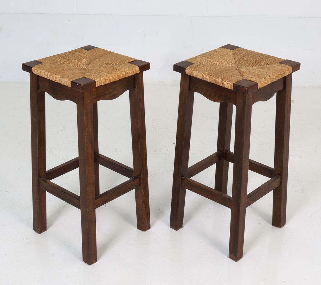 PAIR OF DUTCH OAK & RUSH BAR STOOLS C. 1960S: Pair of oak framed barstools with woven rush seats. Unmarked. Dimensions: H 27" x W 12.5" x D 12.5" x SH 27" Condition: Light wear to cushions. Minor rubs to frame. Wear consistent with age and use as