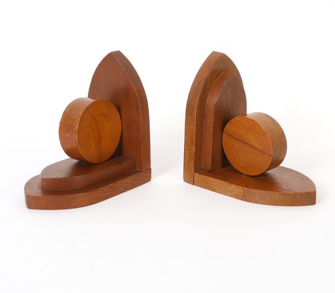PAIR OF DUTCH ART DECO OAK BOOKENDS 1930S: Two Dutch stained oak art deco bookends. Netherlands circa 1930's. Dimensions: H 7" x W 3.75" x D 6.5" Condition: Wear consistent with age and use including dings and rubs. Minor loss to finish. PR074