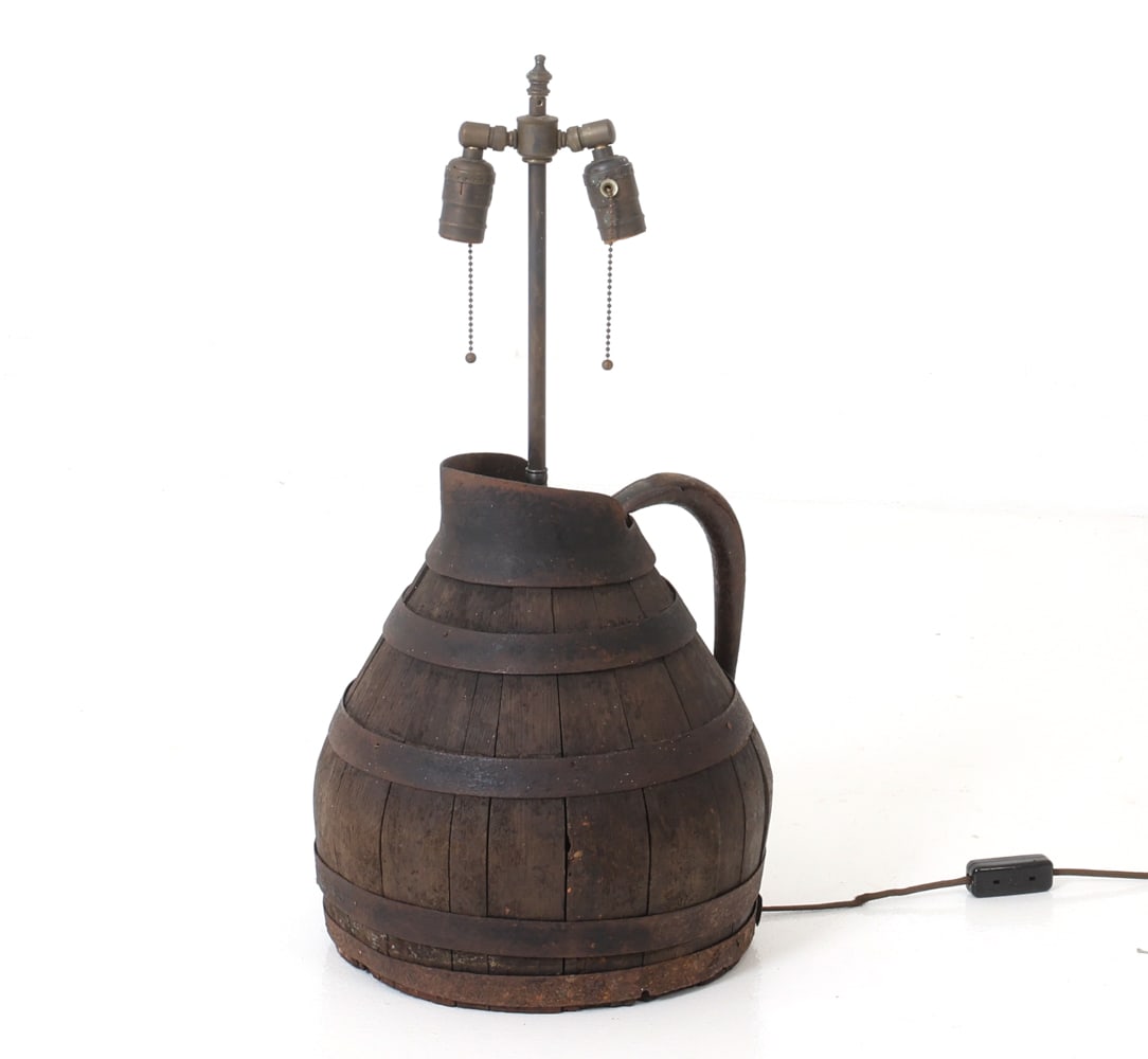 ANTIQUE FRENCH OAK & IRON PITCHER TABLE LAMP: Re Purposed pitcher into a decorative table lamp featuring a two-socket fixture. Circa 19th century Dimensions: H 26" x Dia.12" Condition: Not Tested, Wear consistent with age and use including minor
