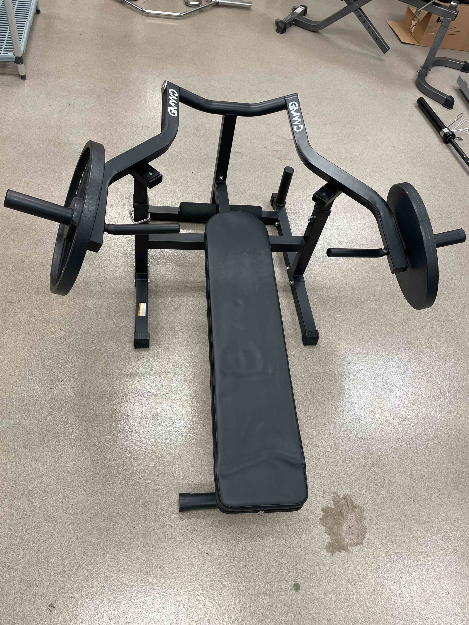 GMWD CHEST PRESS MACHINE WITH 45LBS PLATES: Dimensions: H 30.25" x W 60" x D 63" Condition: Wear consistent with age and use.