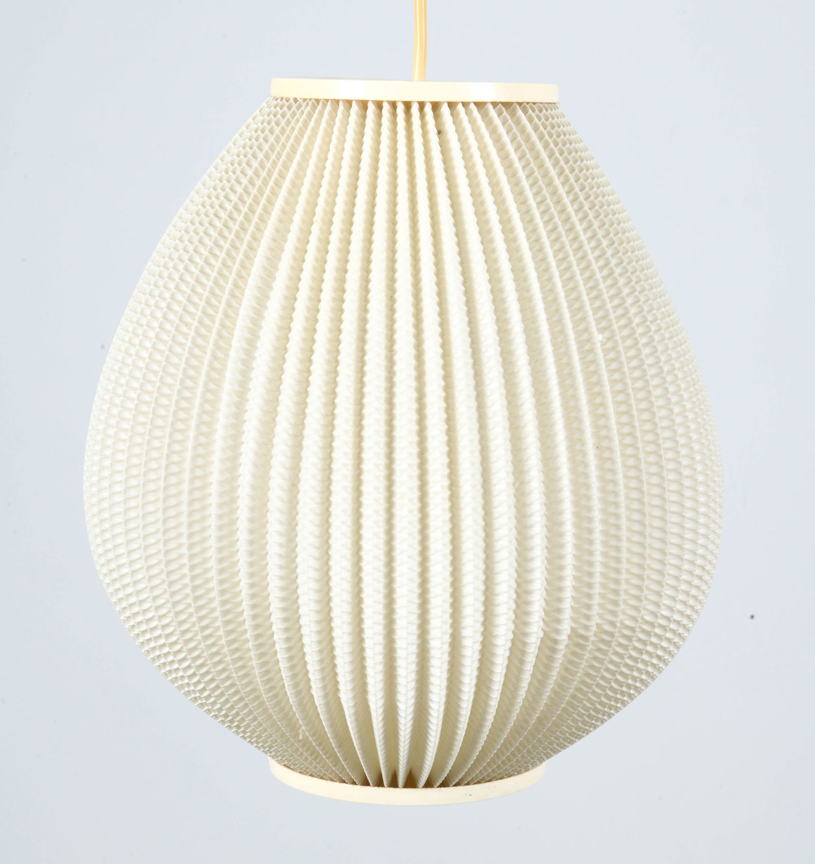 LARS EILER SCHIOLER 'PEARL' PENDANT LIGHT: For Hoyrup Lighting. Pleated plastic shade with texture. Denmark, circa 1960s. Dimensions: Dia. 10". H 11". Length of cable 9.5". Condition: Wear consistent with age and use with minor dents. Slight y