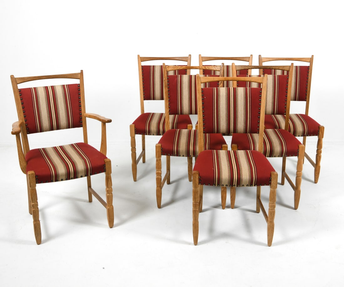 (7) LINDEBJERG DANISH OAK DINING CHAIRS 1970S: By stolefabriken Lindebjerg A/S in style of Henning Kjaernulf. (6) side chairs and (1) armchair. Oak frames with stripe pattern upholstery and brass tacks. Tagged underneath. Denmark, circa 1970s. Dim
