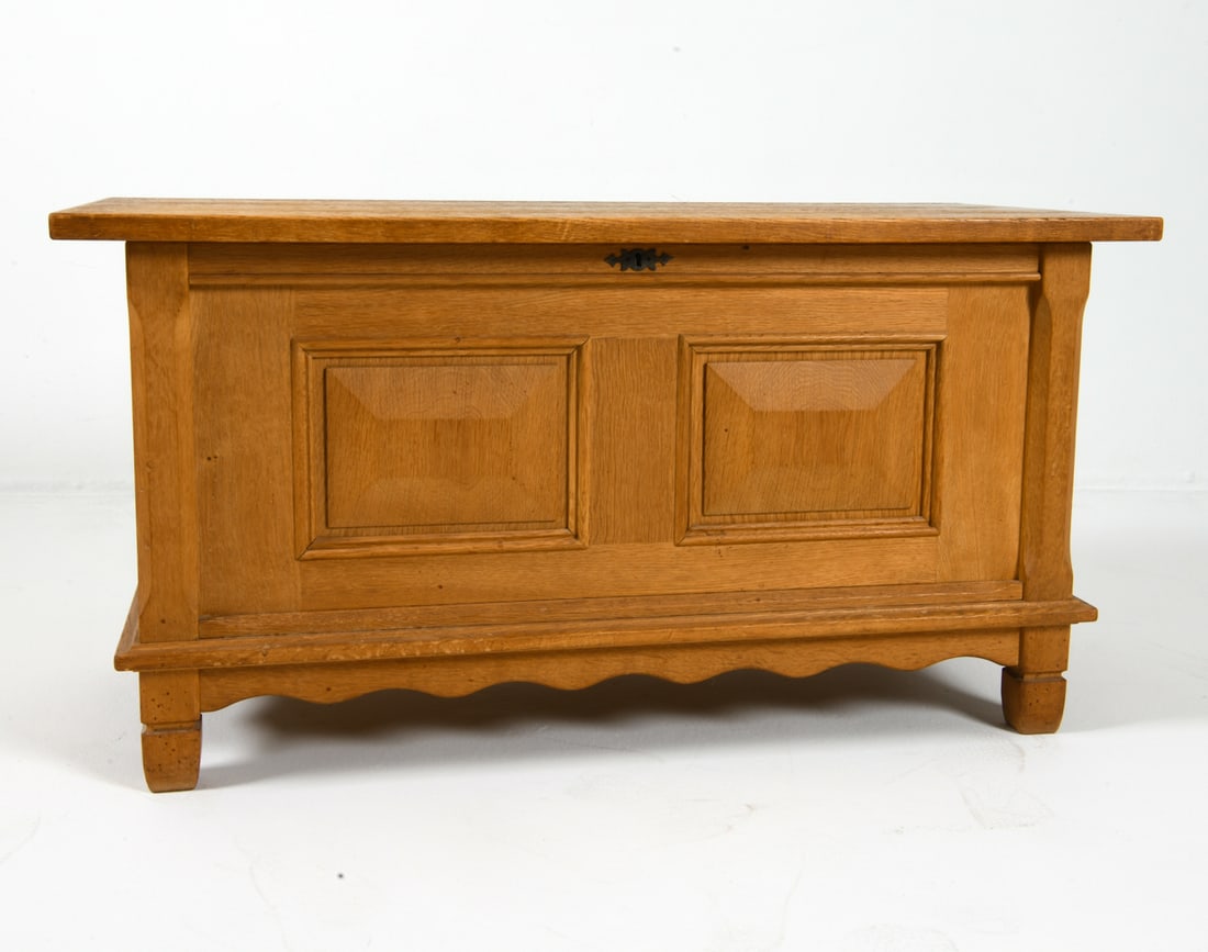 HENNING KJAERNULF FOR NYRUP DANISH OAK CHEST 1960S: Oak chest with sliding compartments inside. Felted lining to compartments. Iron handles. Tagged underneath. Denmark, circa 1960s. Dimensions: H 23.5" x W 44.25" x D 21.75". Condition: Minor scuffs and