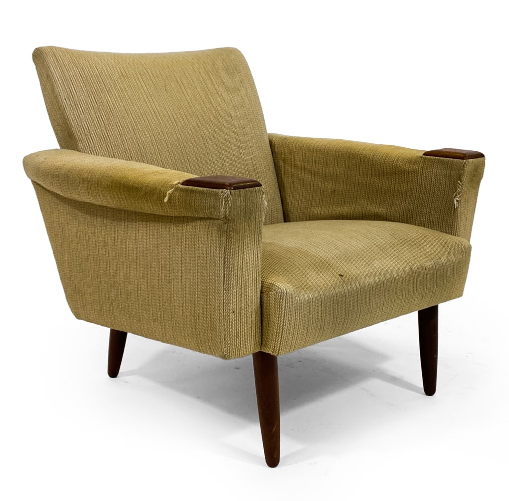 FRITZ HANSEN STYLE DANISH LOUNGE CHAIR C. 1960S: Lounge chair with wool upholstery and rosewood legs and caps at the front tips in armrests. Denmark, circa 1960s. Dimensions: H 31.5" x W 29" x D 27" x SH 14". Condition: Foam stuffing is stiff and de