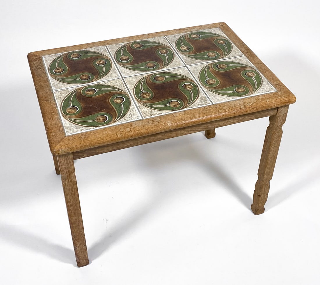 DANISH OAK & TILE TOP SIDE TABLE C. 1970S: Oak side table with ceramic tiles inlaid to top. Denmark, circa 1970s. Dimensions: H 20.5" x W 27.5" x D 19.5". Condition: Showing signs of wear consistent with age and use, including water spots to t
