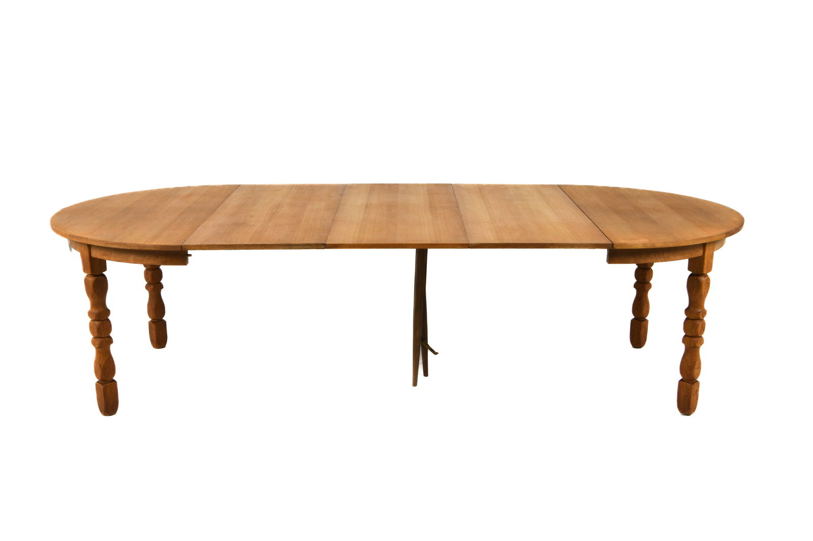 STYLE OF KJAERNULF DANISH OAK DINING TABLE C.1970S: (3) Leaves included. Turned legs with a support. Denmark, circa 1970s. Dimensions: H 28.75" x Dia. 49". Leaves W 20". Condition: Sun fading to top and leaves. Wear consistent with age and use, includi
