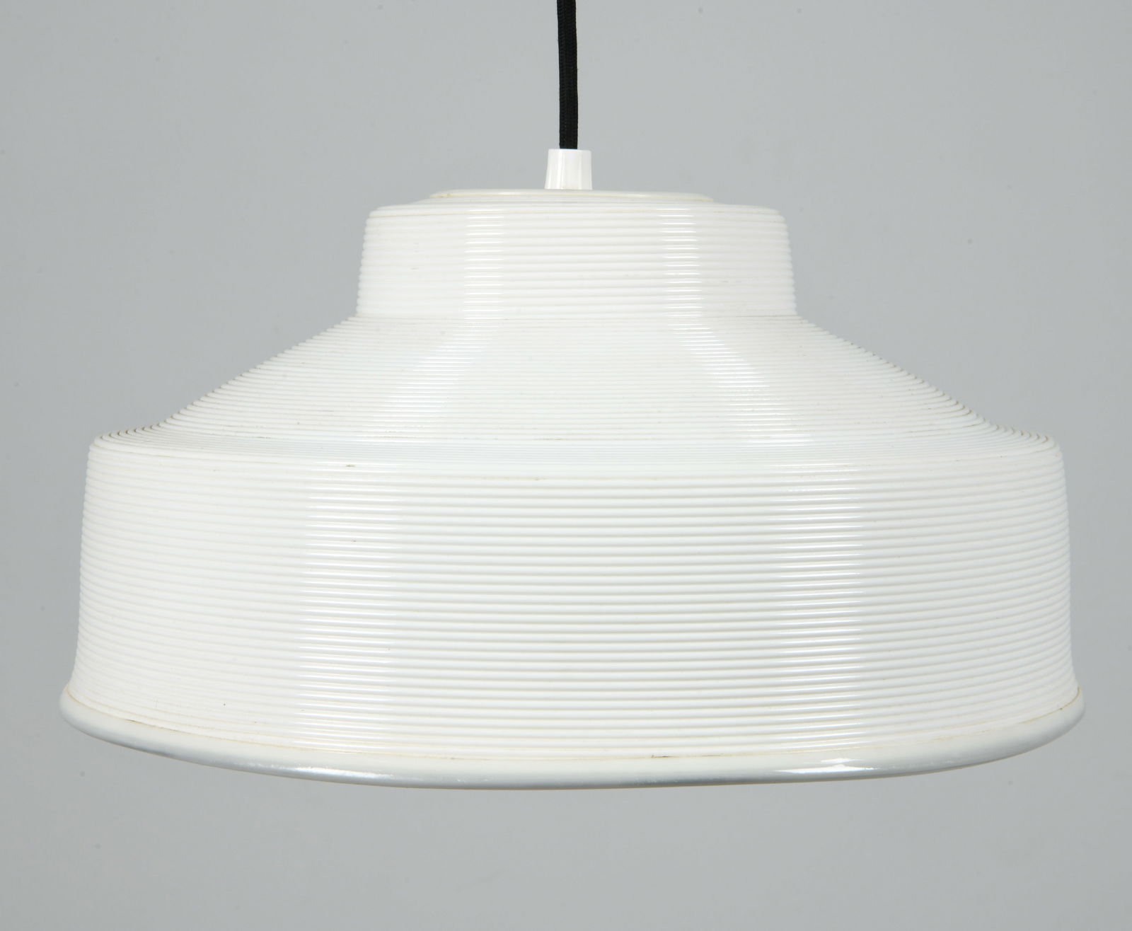 SCANDINAVIAN 'ROTAFLEX' PENDANT LIGHT C. 1960S: Pendant light with ribbed texture to exterior. Apparently untagged. Circa 1960s. Dimensions: Dia. 11.5". H 7". Condition: Wear consistent with age and use. Wiring untested.