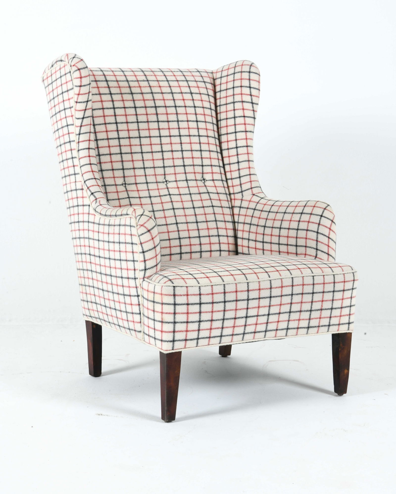STYLE OF HENNINGSEN DANISH LOUNGE CHAIR C. 1970S: Wingback lounge chair with plaid upholstery. Beech feet. Denmark, circa 1970s. Dimensions: H 41" x W 27" x D 26" x S.H. 15". Condition: Minor scuffs and scratches to legs, wear consistent with age and