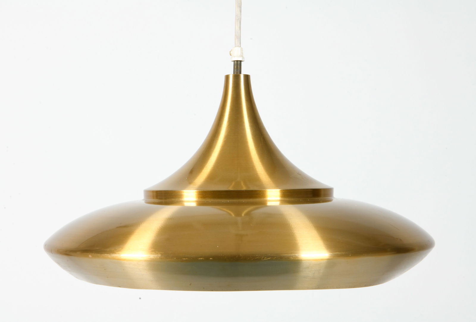 DANISH SAUCER PENDANT LIGHT C. 1970S: Saucer pendant light with brushed brass tone finish. Denmark, circa 1970s. Dimensions: H 8" x Dia. 17". Overall Cable Length 24". Condition: Slight bend to bottom inner ring. Wear commensurate with ag