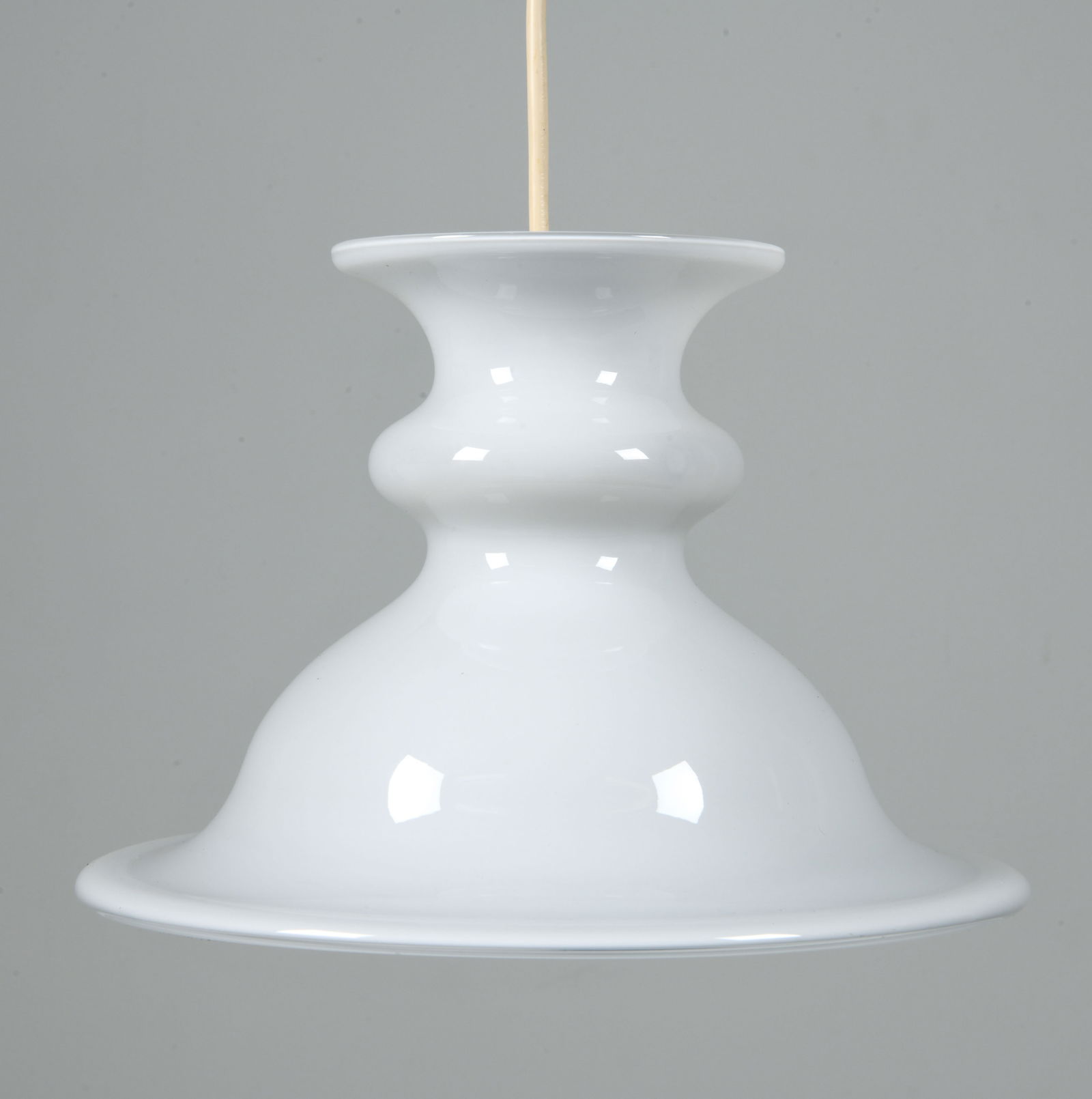 SIDSE WERNER HOLMEGAARD TIVOLI PENDANT LIGHT: Glass pendant light with shaped silhouette. Tagged to socket. Denmark, circa 1980s. Dimensions: H 7" x Dia. 10". Condition: Wear consistent with age and use. Wiring untested.