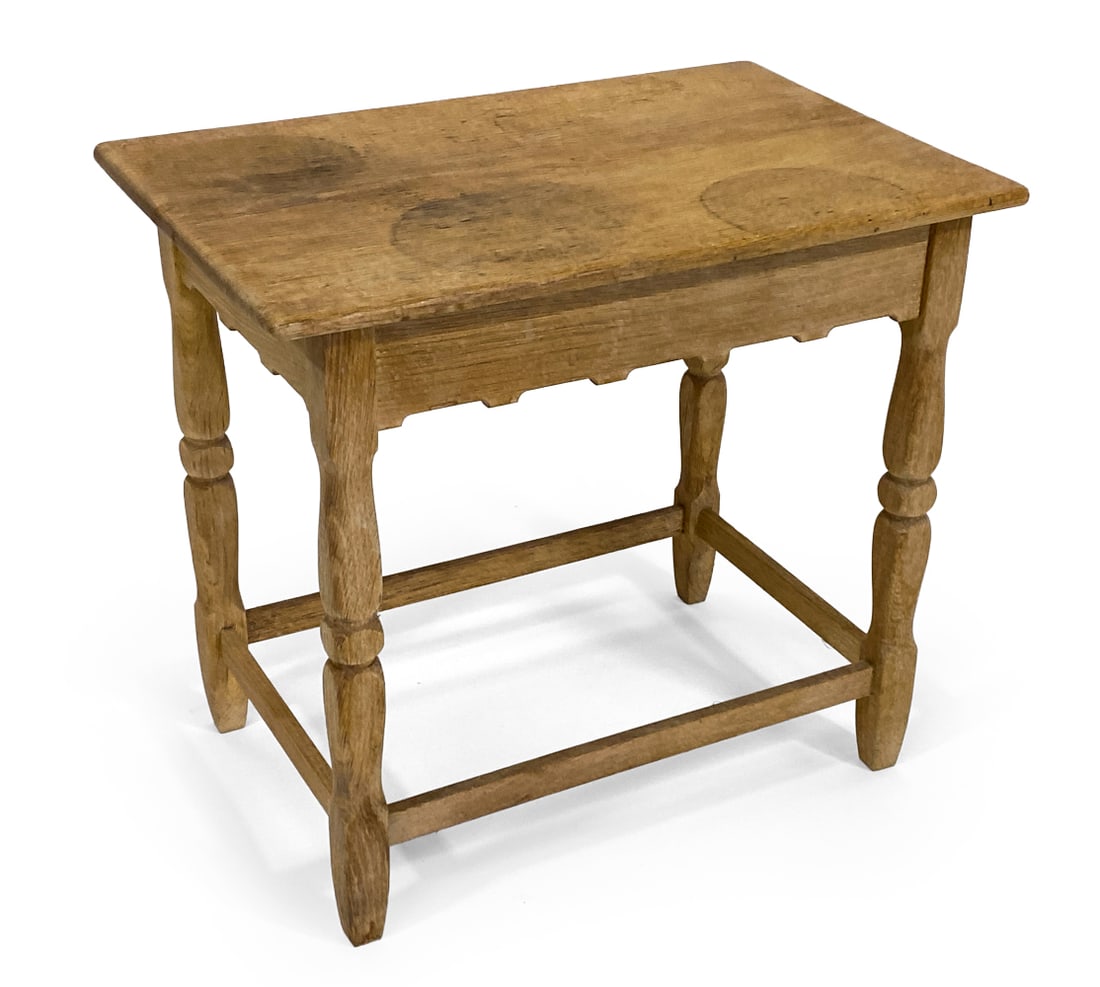 DANISH OAK SIDE TABLE C. 1970S: Small oak side table with carved apron. Denmark, circa 1970s. Dimensions: H 19" x W 22" x D 15". Condition: Water spots and discoloration to frame. Wear consistent with age and use, including dings an