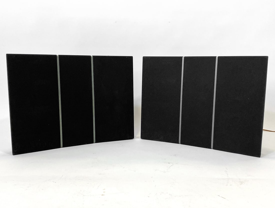 PAIR OF BANG & OLUFSENRP 7000 SPEAKERS: Branded to speaker covers and on backs. Includes floor mounts. Denmark, Circa 1970s. Dimensions: H 16" x W 21.5" x D 7". Condition: Wiring untested. Minor scuffs, wear consistent with age and use.