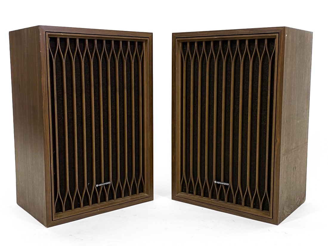 PAIR OF KENWOOD KL-777 FLOOR SPEAKERS C. 1970S: Mahogany case with Art Deco styling to fronts. Circa 1970s. Dimensions: H 25" x W 16.75" x D 11.75". Condition: Wiring untested. Few scuffs and dings to corners. Wear consistent with age and use.