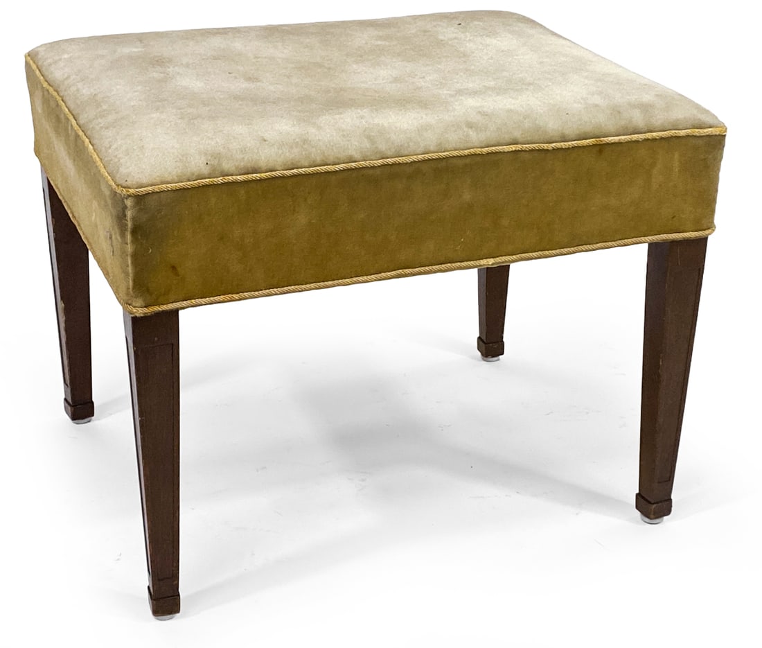 MID-CENTURY MOHAIR OTTOMAN BENCH C. 1950S: Mahogany tapered legs with green mohair upholstery. Circa 1950s. Dimensions: 15" x W 20" x D 16.5". Condition: Few discolored spots to mohair. Scuffs and rubs to legs. Wear consistent with age and use