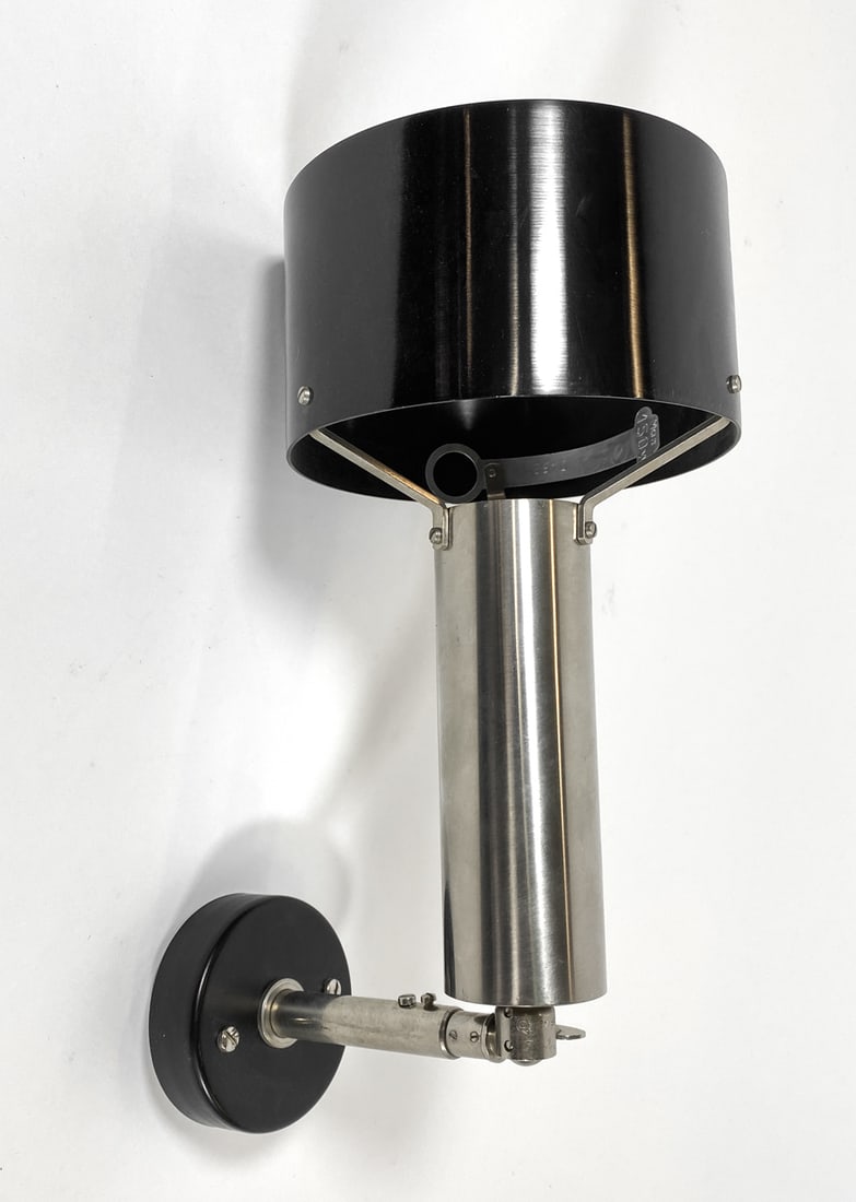 NORDISK DANISH SPOTLIGHT WALL SCONCE C. 1960S: Adjustable wall sconce with steel wall bracket. Apparently untagged. Denmark, circa 1960s. Dimensions: H 14.5" x Dia. 5.5". Condition: Wiring untested. Minor scuffs. Wear consistent with age and use.