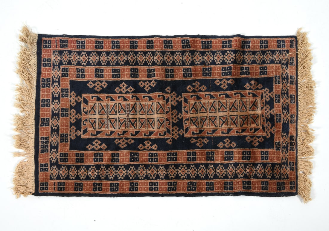 HAND-KNOTTED BELOUCH BALISHT BAG-FACE RUG: Hand-woven textile or rug with red and blue geometric design. 20th century. Dimensions: L 43" x W 24.5". Condition: Sun fading and discoloration to fringe, wear consistent with age and use.
