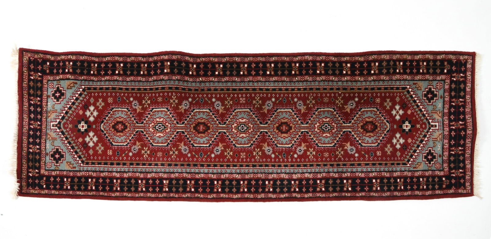 HAND-KNOTTED PERSIAN HAMADAN RUNNER RUG: Hand-knotted wool with red and blue geometric designs. Mid 20th century. Dimensions: L 103" x H 32". Condition: Minor fading, wear consistent with age and use.