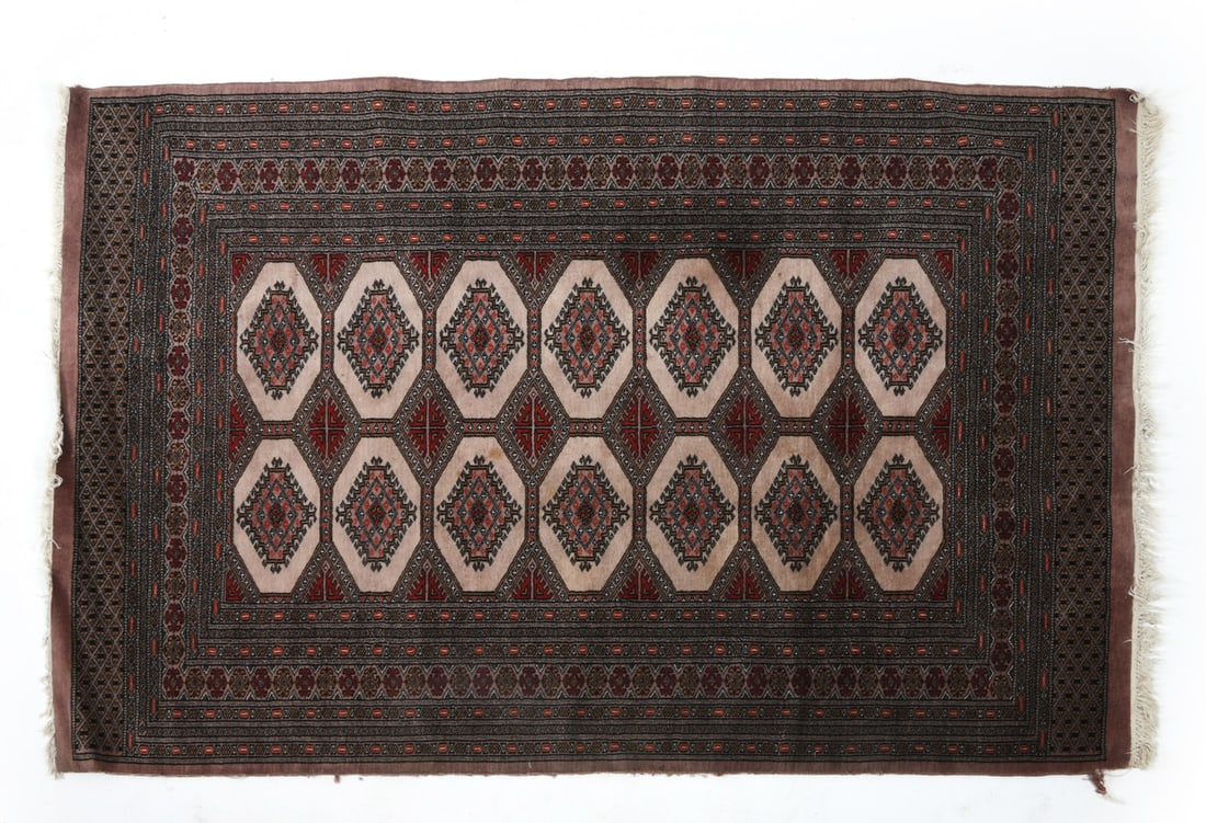 HAND-KNOTTED PAKISTANI BOKHARA WOOL RUG: Hand-knotted wool rug with beige and cream geometric designs. Mid 20th century. Dimensions: L 79" x H 51". Condition: Sun fading and minor surface soiling. Tear to corner. Wear consistent with age and