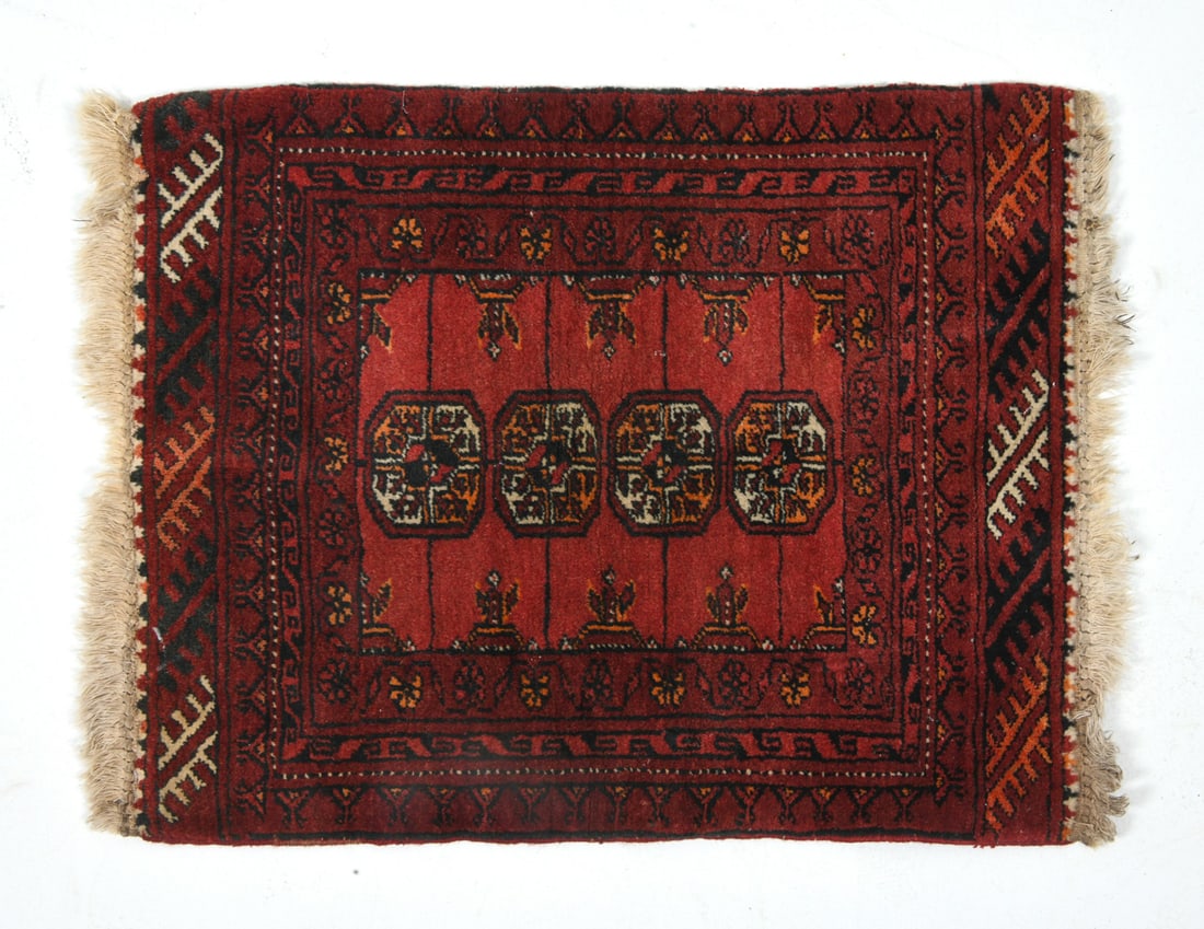 HAND-KNOTTED AFGHAN TRIBAL WOOL RUG: Hand-knotted wool rug with red, cream, and blue geometric designs. Mid 20th century. Dimensions: L 28" x H 21". Condition: Minor sun fading and discoloration to fringe. Wear consistent with age and us