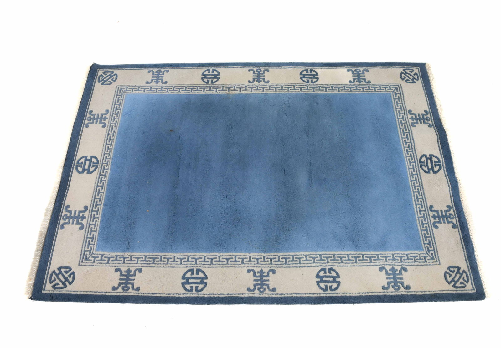 HAND-KNOTTED CHINESE PEKING WOOL RUG: Hand-woven wool rug with cream and blue designs. 20th century. Dimensions: L 123" x W 79.5". Condition: Wear consistent with age and use. Few discolored spots.