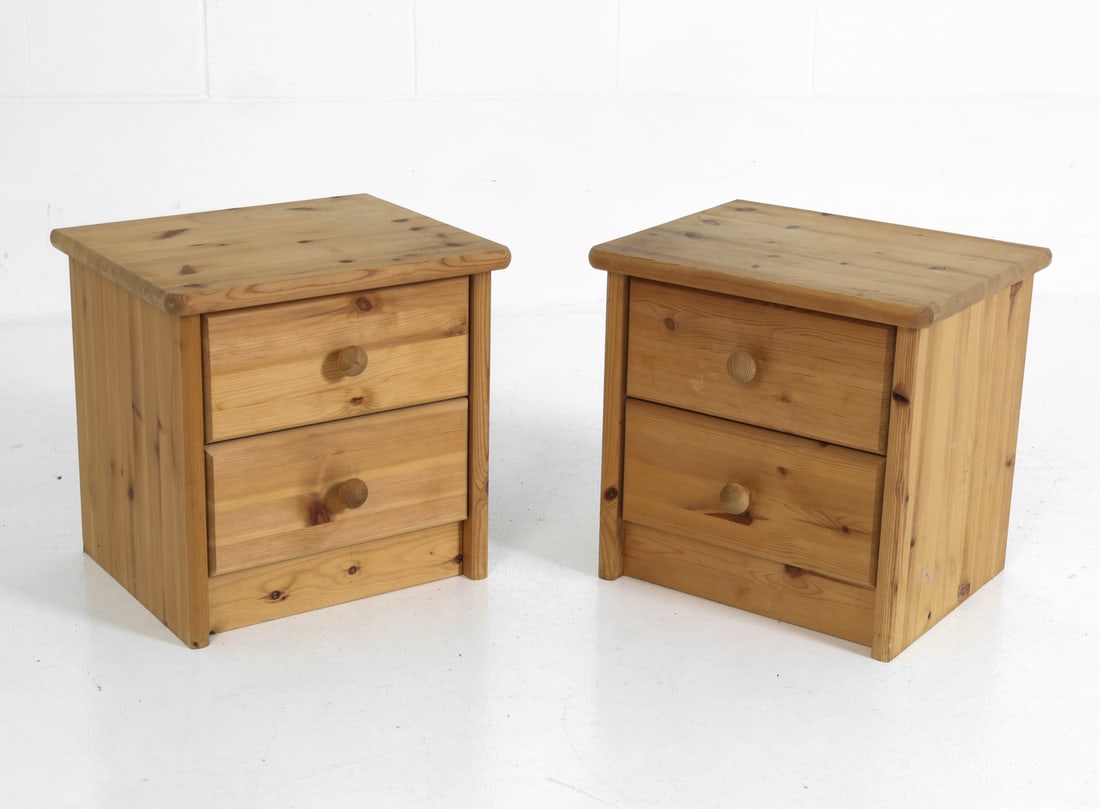 PAIR OF SWEDISH PINE NIGHTSTANDS C. 1970S: Pair of pine nightstands with two drawers each and round pulls. Unmarked. Sweden, circa 1970s. Dimensions: H 17.75" x W 18.25" x D 15.5" Condition: Wear consistent with age and use including minor